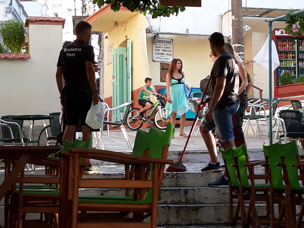 If you're wondering about the sweeping going on, it's because someone up the street has a habit of emptying their washing machine water down the steps. It floods through the bars and needs to be swept out of the way so the stones dry as quickly as possible before people slip over.