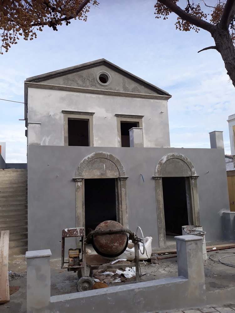 Opposite the supermarket; coming on.