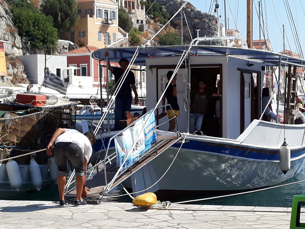 A traditional boat and I believe the trip comes with lunch too, and a smaller party of travelers.