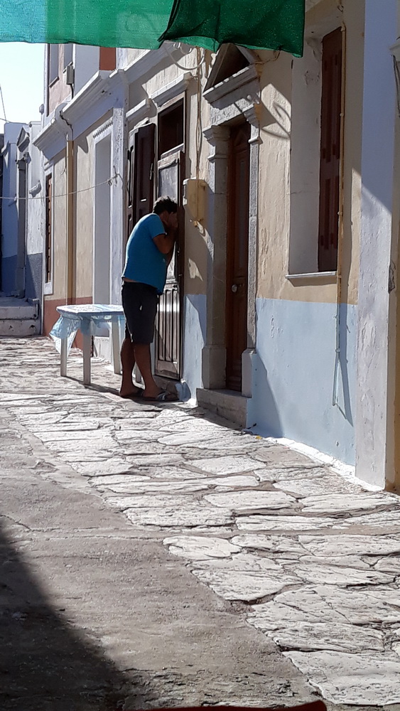 He checks on his elderly customers, visiting the houses of regulars to see if they want anything, and then going back to his van to collect it and deliver it for them.