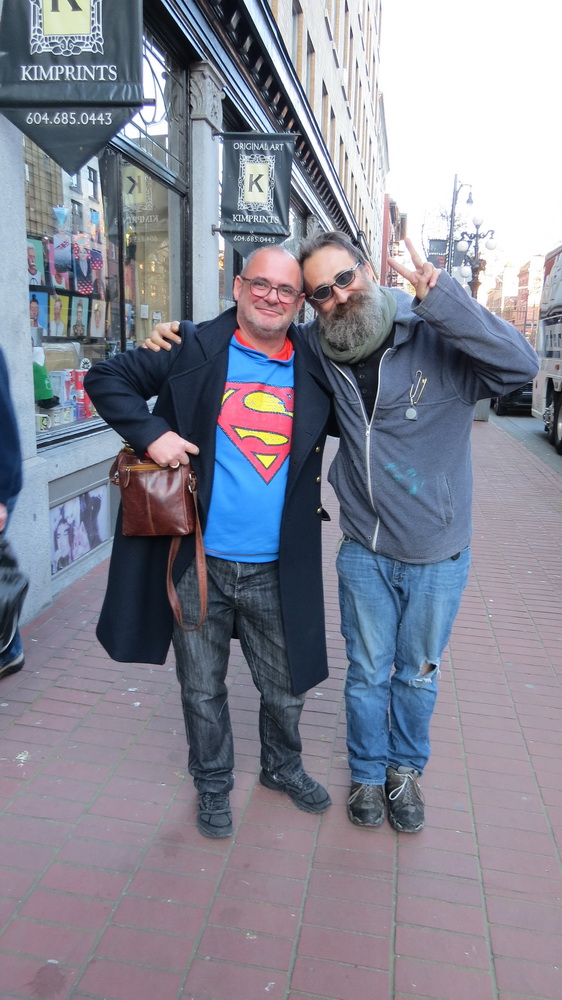 Neil interviewing a homeless man who'd asked us, in the way nly Canadians do, if we had 'a dollar you might lend me, sorry to ask, if yuo really don't mind, thank you, Sir, and yuo have a great rest of the day now, and welcome to Canada.'